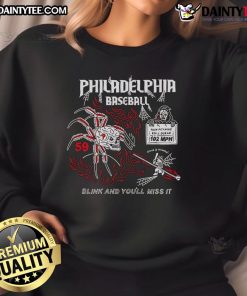 Alt Text: Cozy Top Philadelphia Baseball Halloween sweatshirt featuring a fun Blink And You'll Miss It design for fans.