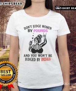 Women's tee featuring a top skeleton design with the slogan 'Don't Judge Women By Pounds And You Won't Be Judged By Inches'.