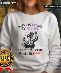 Top Skeleton sweatshirt with 'Don't Judge Women By Pounds And You Won't Be Judged By Inches' slogan in bold design.
