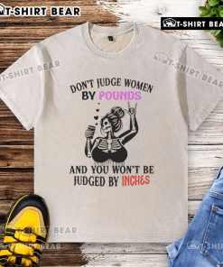 Alt Text: Top Skeleton design on a washed t-shirt with the quote 'Don't judge women by pounds and you won't be judged by inches.'