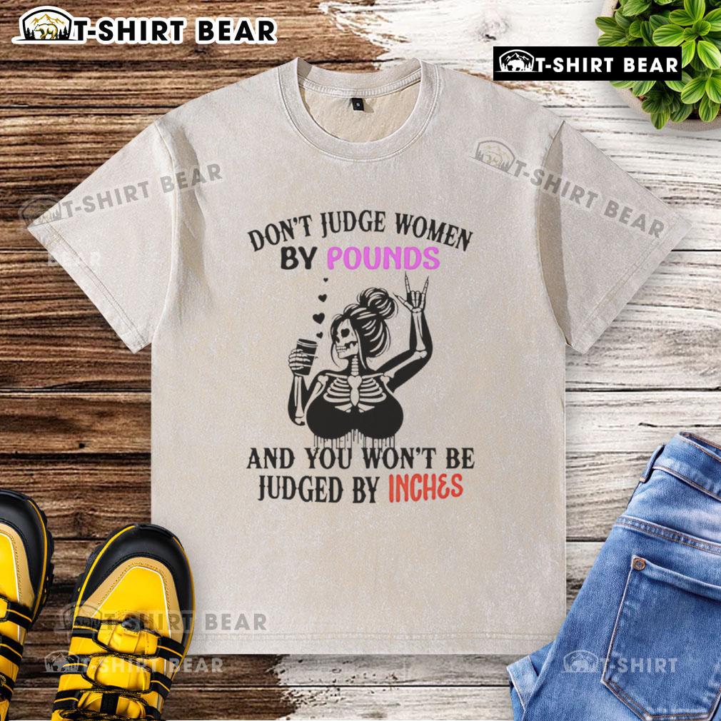 Top Skeleton Don't Judge Women By Pounds And You Won't Be Judged By Inches Washed T-Shirt Alt Text: Top Skeleton design on a washed t-shirt with the quote 'Don't judge women by pounds and you won't be judged by inches.'