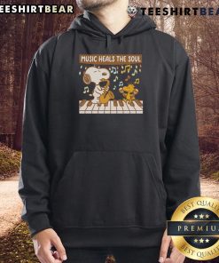Cozy hoodie featuring Snoopy and Woodstock with the phrase 'Music Heals The Soul' perfect for Peanuts fans.