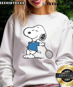 Cartoon sweatshirt featuring Snoopy as a top tennis player, perfect for fans of Peanuts and sports apparel.