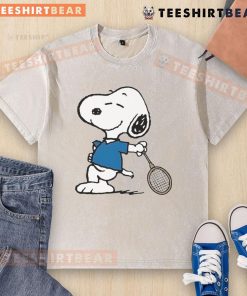 Cartoon Snoopy as a tennis player on a washed t-shirt, showcasing fun sports fashion and playful design.
