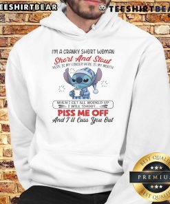 Cranky short woman wearing 'I'm a Cranky Short and Stout' hoodie, pointing at her mouth with a playful expression.