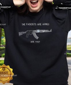 Top The Fascists Are Armed Are You Sweatshirt featuring bold text design for activism and awareness.
