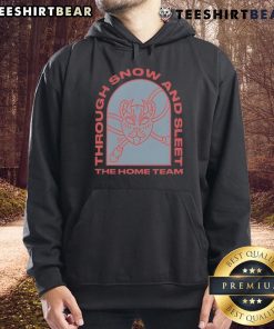 Cozy Top The Home Team hoodie worn during snowy weather, perfect for fans braving snow and sleet outdoors.