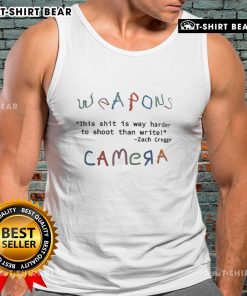 Zach Cregger wearing a tank top, showcasing top weapons, captioned 'This shit is way harder to shoot than write.'