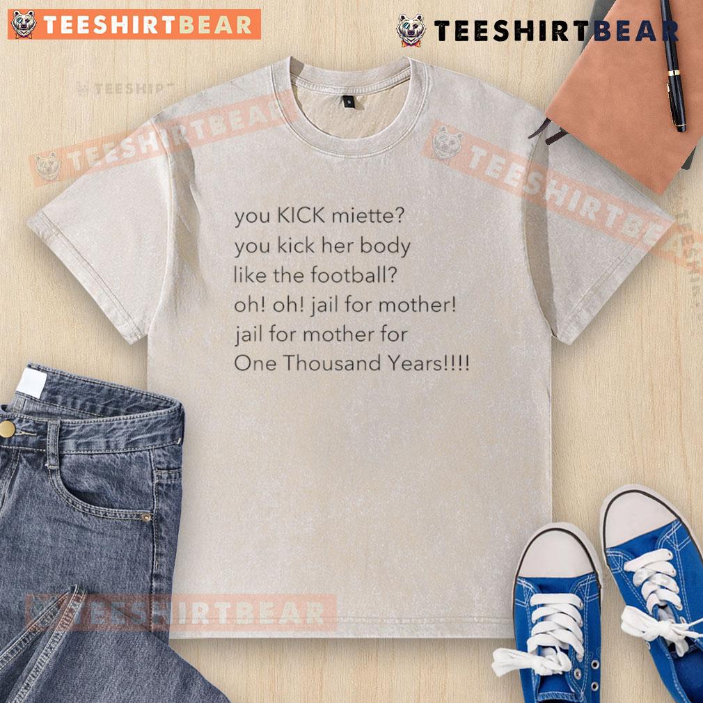 Top You Kick Miette You Kick Her Body Like The Football Washed T Shirt Alt Text: Top You Kick Miette You Kick Her Body Like The Football washed t-shirt featuring a playful football graphic design.