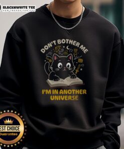 Cute cat in a cozy sweatshirt with 'Don't Bother Me, I'm in Another Universe' text, perfect for cat lovers.