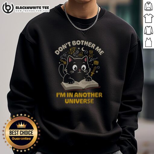 Cute cat in a cozy sweatshirt with 'Don't Bother Me, I'm in Another Universe' text, perfect for cat lovers.