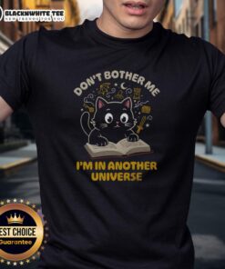 Alt Text: Cute cat graphic on a 'Don't Bother Me I'm In Another Universe' t-shirt, perfect for cat lovers and quirky fashion.