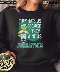 Awesome Athletics Grinch Christmas sweatshirt featuring 'They Hate Us Ain't Us' design, perfect for holiday cheer.