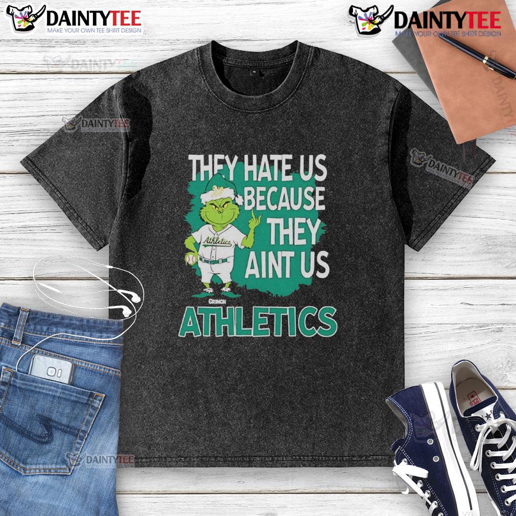 Awesome Athletics Grinch Christmas They Hate Us Ain'T Us Washed T Shirt Alt Text: Awesome Athletics Grinch Christmas T-Shirt featuring 'They Hate Us Ain't Us' design for festive sports fans.