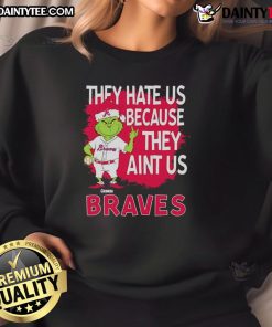 Awesome Atlanta Braves Grinch Christmas sweatshirt featuring 'They Hate Us Ain't Us' design, perfect for fans.