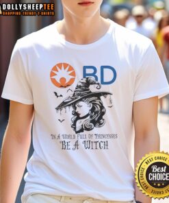 Alt Text: Awesome Becton Dickinson Halloween T-Shirt featuring 'In A World Full Of Princesses Be A Witch' design.