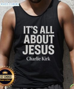 Alt Text: Charlie Kirk wearing a stylish tank top featuring 'It's All About Jesus' emphasizing Christian faith.