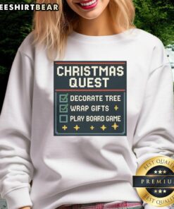 Awesome Christmas Quest sweatshirt featuring tree decoration, gifts, and a playful board game theme for festive fun.