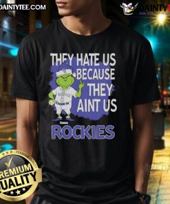 Alt Text: Awesome Colorado Rockies Grinch Christmas T-shirt featuring They Hate Us Ain't Us design for festive fans.