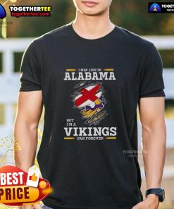 Awesome I May Live In Alabama But I'm A Minnesota Vikings Fan Forever T-Shirt design featuring team colors and logo.