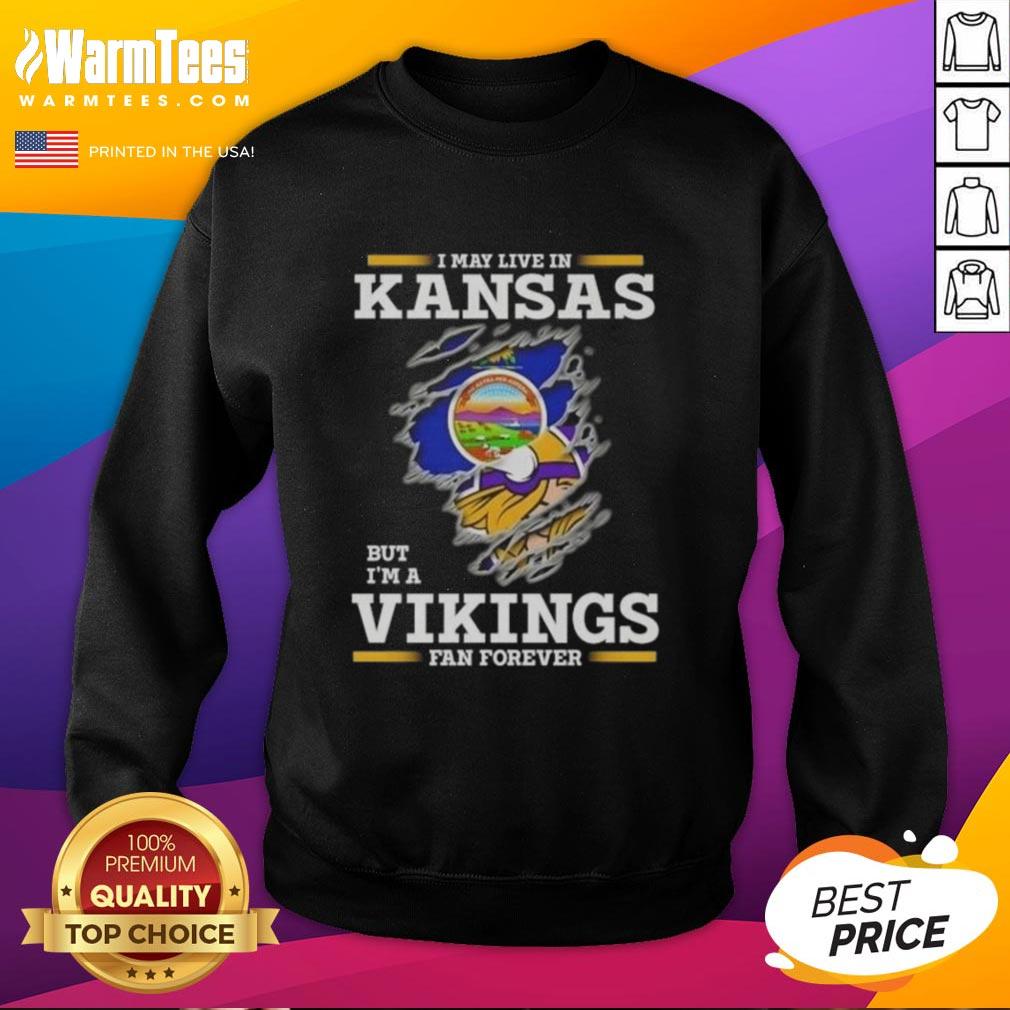 Awesome I May Live In Kansas But I'M A Minnesota Vikings Fan Forever Sweatshirt Alt Text: Awesome sweatshirt for Minnesota Vikings fans living in Kansas, showcasing team pride and loyalty.