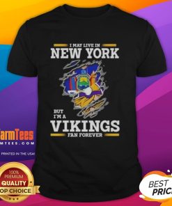 Awesome I May Live In New York But I'M A Minnesota Vikings Fan Forever T-Shirt featuring bold team colors and graphics.