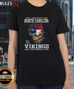 North Carolina lady wearing a Minnesota Vikings fan tee, showcasing team pride and style in vibrant colors.