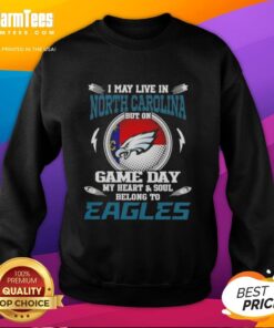 Cozy sweatshirt featuring 'I may live in North Carolina, but my heart belongs to Philadelphia Eagles' design.