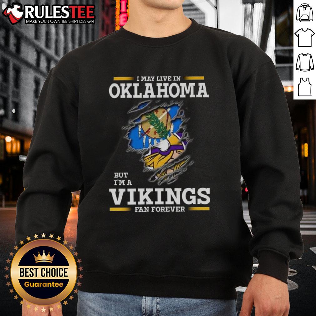 Awesome I May Live In Oklahoma But I'm A Minnesota Vikings Fan Forever Sweatshirt Awesome Minnesota Vikings fan sweatshirt, perfect for showing team pride while living in Oklahoma.
