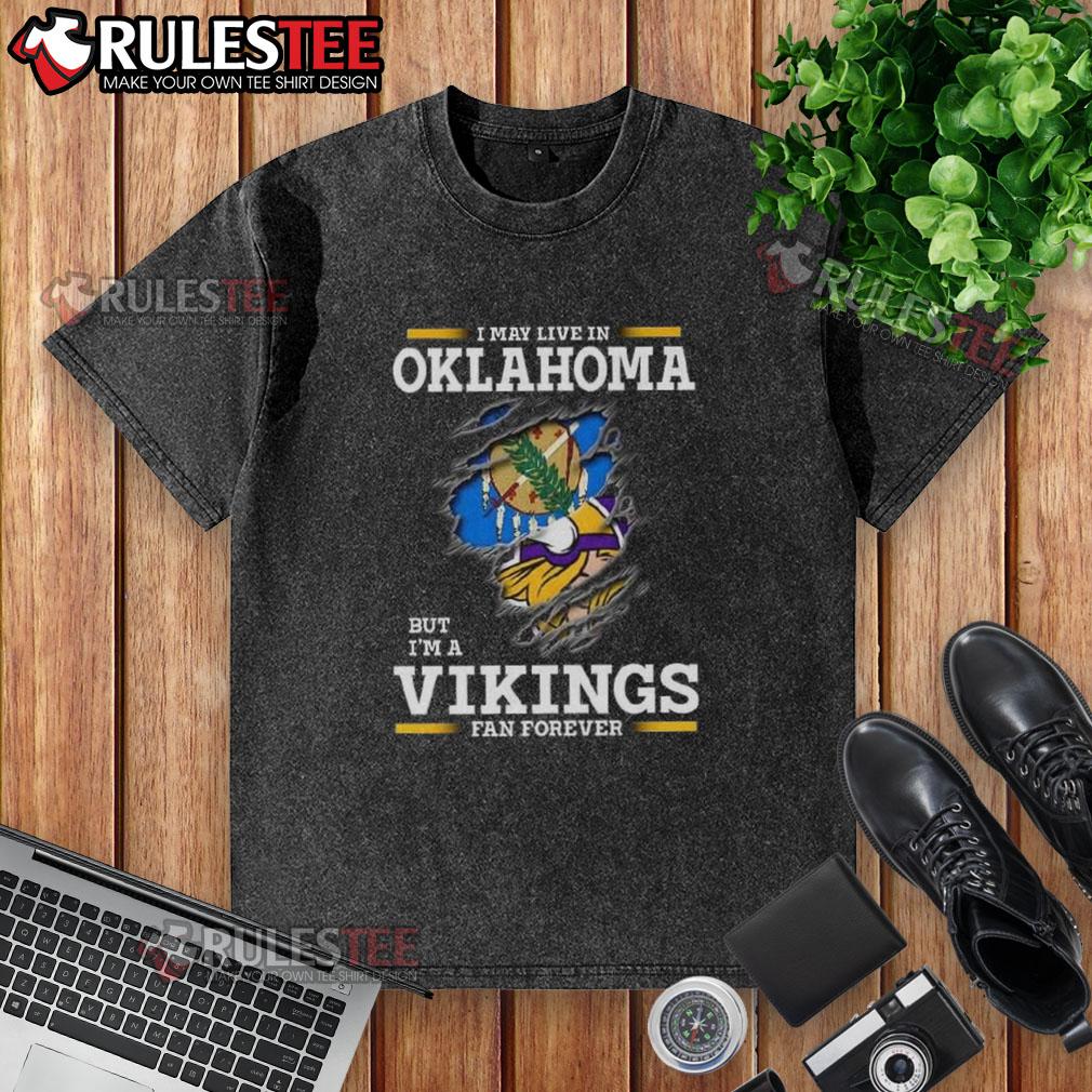 Awesome I May Live In Oklahoma But I'm A Minnesota Vikings Fan Forever Washed T-Shirt Awesome washed t-shirt featuring 'I may live in Oklahoma but I'm a Minnesota Vikings fan forever' design.
