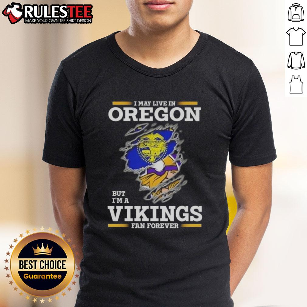 Awesome I May Live In Oregon But I'M A Minnesota Vikings Fan Forever T Shirt Awesome t-shirt featuring 'I May Live In Oregon But Im A Minnesota Vikings Fan Forever' design for passionate fans.