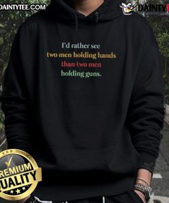 Two men holding hands in a park, wearing the 'I'd Rather See Two Men Holding Hands Than Two Men Holding Guns' hoodie.