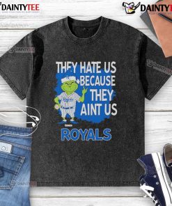 Alt Text: Kansas City Royals Grinch Christmas T-shirt featuring 'They Hate Us, Ain't Us' design for festive fans.