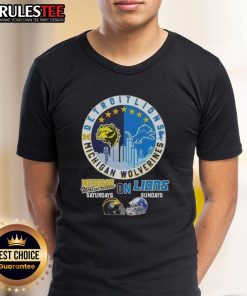 Awesome Michigan Wolverines Saturdays and Detroit Lions Sundays T-shirt with helmet and skyline design, perfect for fans.