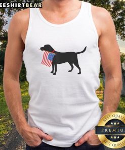 Patriotic dog wearing an American flag tank top, celebrating the Fourth of July, perfect for pet lovers in the USA.