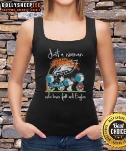 Woman wearing an Awesome Peanuts tank top, celebrating fall and Philadelphia Eagles football in a cozy outdoor setting.