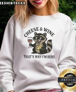 Awesome raccoon graphic on a cheese and wine sweatshirt, perfect for cozy gatherings and casual outings.
