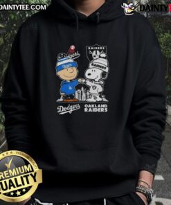 Alt Text: Awesome Snoopy and Charlie Brown hoodie featuring Los Angeles Dodgers and Las Vegas Raiders skyline design.