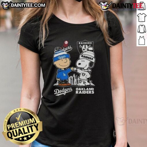 Alt Text: Awesome Snoopy and Charlie Brown graphic on a Los Angeles Dodgers x Las Vegas Raiders skyline ladies tee.