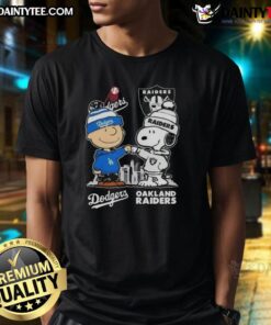 Alt Text: Awesome Snoopy and Charlie Brown t-shirt featuring Los Angeles Dodgers and Las Vegas Raiders skyline design.