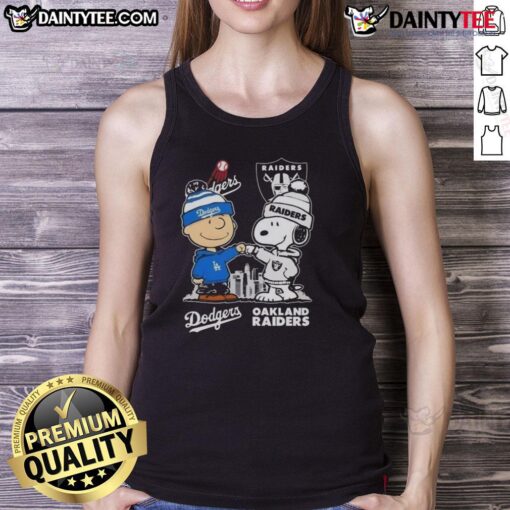 Alt Text: Awesome Snoopy and Charlie Brown tank top featuring Los Angeles Dodgers and Las Vegas Raiders skyline design.
