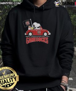 Alt Text: Snoopy wearing a South Carolina Gamecocks football hoodie while driving a car, showcasing team spirit and fun.