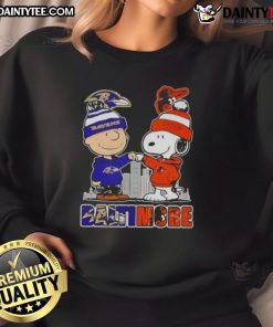 Awesome Snoopy X Charlie Brown sweatshirt featuring Baltimore Ravens and Orioles skyline design.