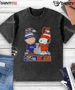 Awesome Snoopy X Charlie Brown Baltimore Sports Ravens X Orioles skyline washed t-shirt featuring iconic characters and cityscape.