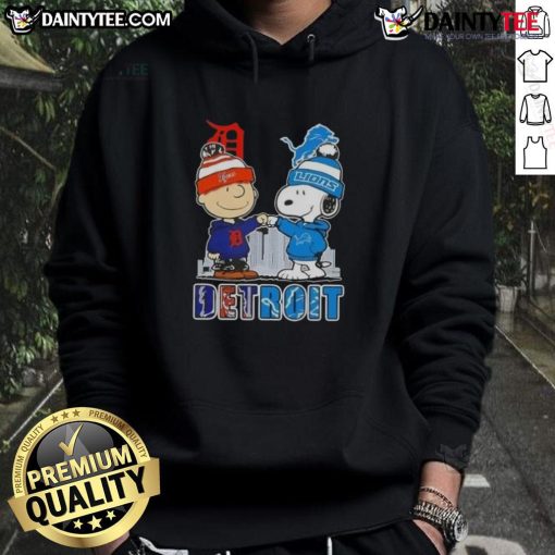 Awesome Snoopy X Charlie Brown hoodie featuring Detroit Tigers and Lions skyline design, perfect for sports fans.