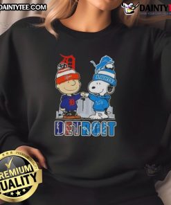 Awesome Snoopy X Charlie Brown Detroit Sports Tigers X Lions Skyline Sweatshirt featuring iconic characters and city skyline.