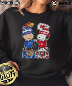 Awesome Snoopy X Charlie Brown Kansas Sports Jayhawks X Chiefs skyline sweatshirt featuring vibrant graphics and cozy design.