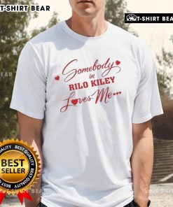 Awesome Somebody In Rilo Kiley Loves Me T-Shirt featuring a stylish design and vibrant colors, perfect for fans of the band.