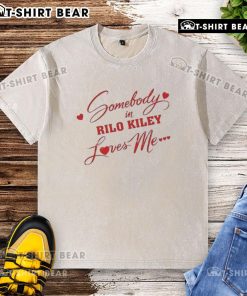 Alt Text: Awesome Somebody In Rilo Kiley Loves Me washed t-shirt displayed on a mannequin, showcasing its vintage style.