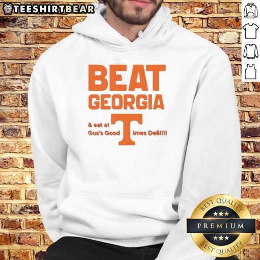 Alt Text: Tennessee Volunteers fans wearing hoodies celebrate victory over Georgia at Guss Good Times Deli.